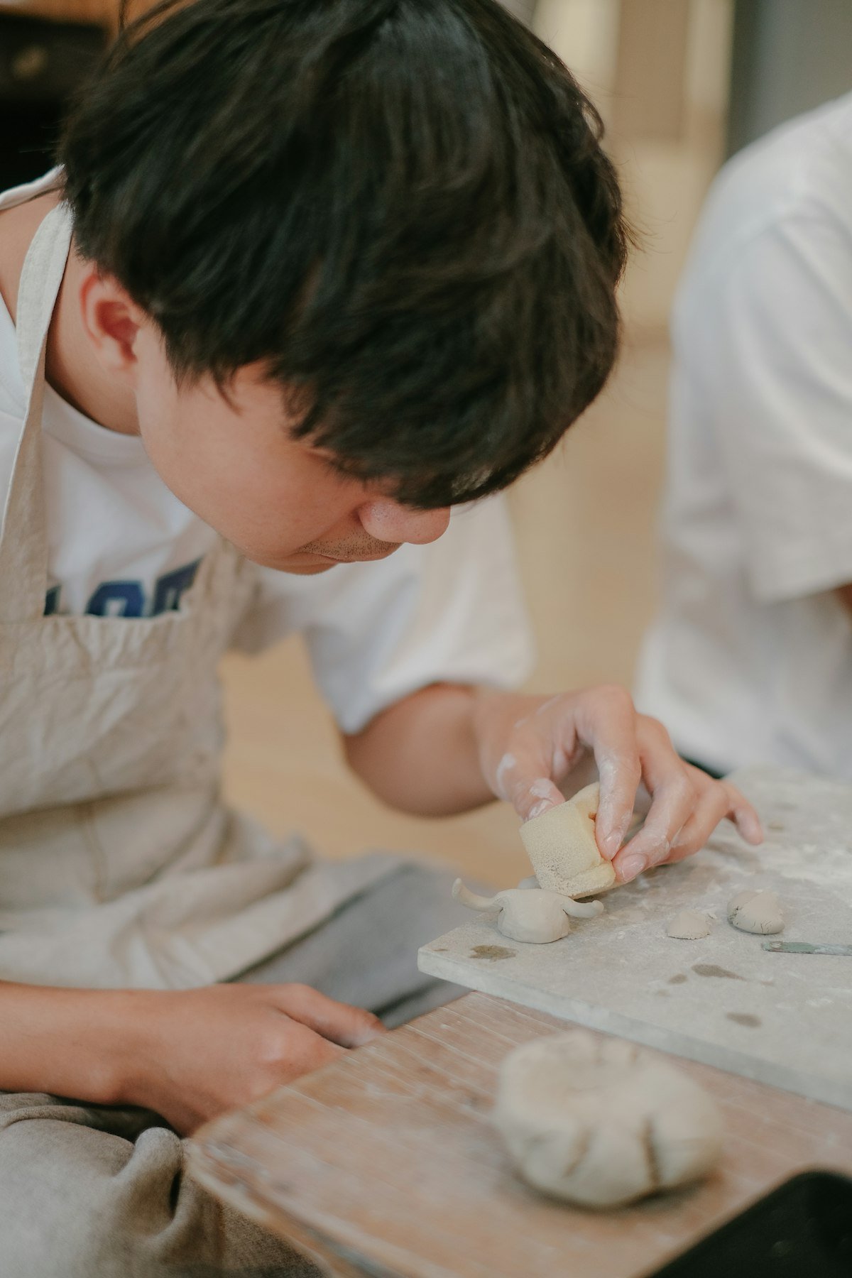 A young man preparing food, building practical life skills